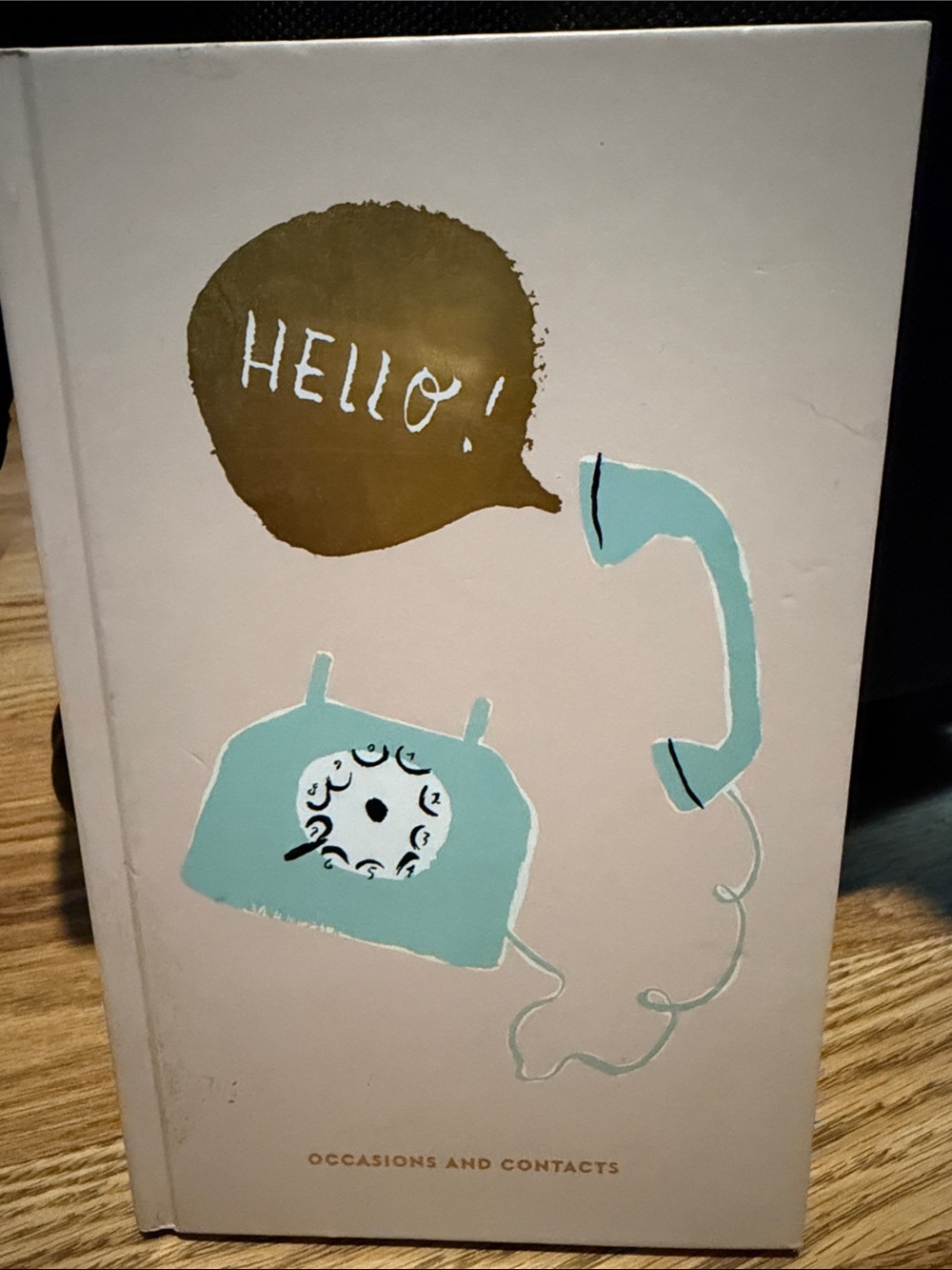 kate spade Gold Logo on Cream Surface